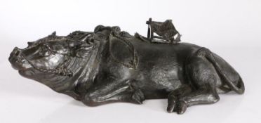 Large 19th Century Chinese bronze ox, modelled in a laying position with saddle covering a small