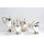 A 20th century Mexican silver four-piece tea set, stamped 925 Sterling, comprising teapot, hot water