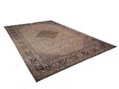 A good and large Isphahan carpet, central dark blue lozenge medallion on ivory field, all-over