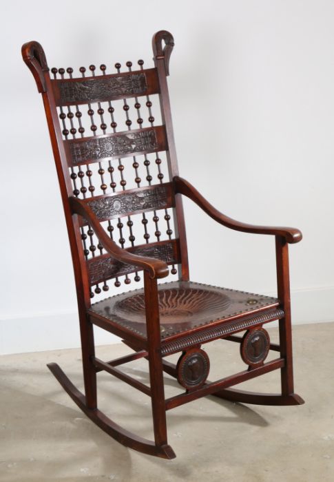 Aesthetic Movement beech and embossed hide rocking chair of unusual design with Japanesque and