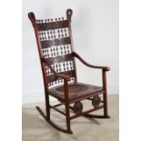 Aesthetic Movement beech and embossed hide rocking chair of unusual design with Japanesque and