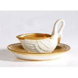 An early 19th Century Dagoty porcelain sauce boat and saucer, the sauce boat modelled as a swan with