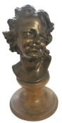 Austro-German School (early 20th century) A bronze bust of a smiling young lady with curly locks,
