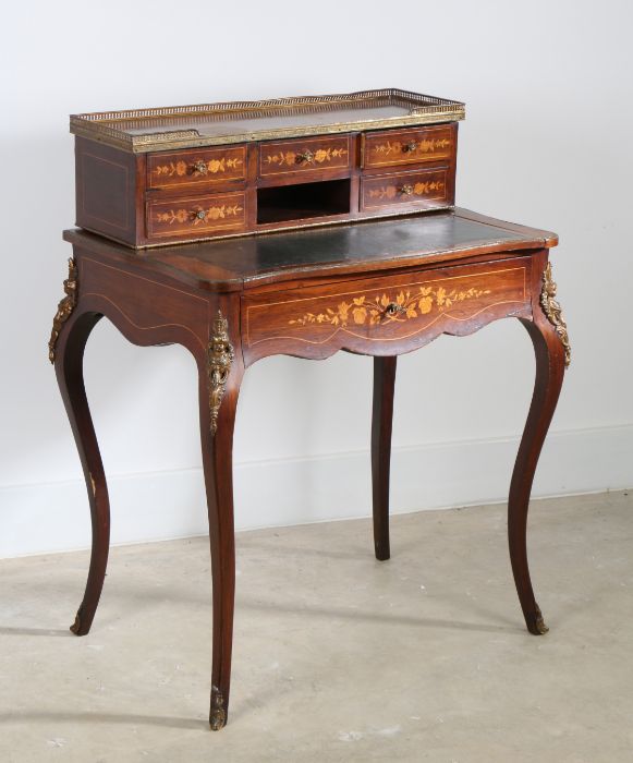 A 19th Century rosewood and inlaid escritoire, the gilt metal gallery top above five foliate small