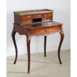 A 19th Century rosewood and inlaid escritoire, the gilt metal gallery top above five foliate small