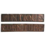 In the style of the Keswick School of Industrial Arts, a pair of beaten copper panels, embossed "