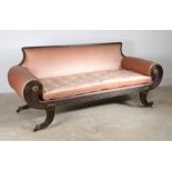A Regency painted settee, the pad back and painted frame with scroll arms surmounted by gilt metal