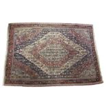 A fine Kilim rug, the central medallion on blue, red and ivory field, stylised floral motifs,