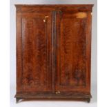 A 19th Century scrub faux grained painted cabinet, the rectangular top with a shallow pediment above