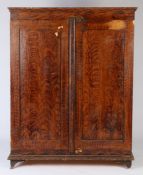 A 19th Century scrub faux grained painted cabinet, the rectangular top with a shallow pediment above