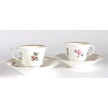 Pair of early 19th Century John Rose Coalport cups and saucers, the white cups and saucers with gilt