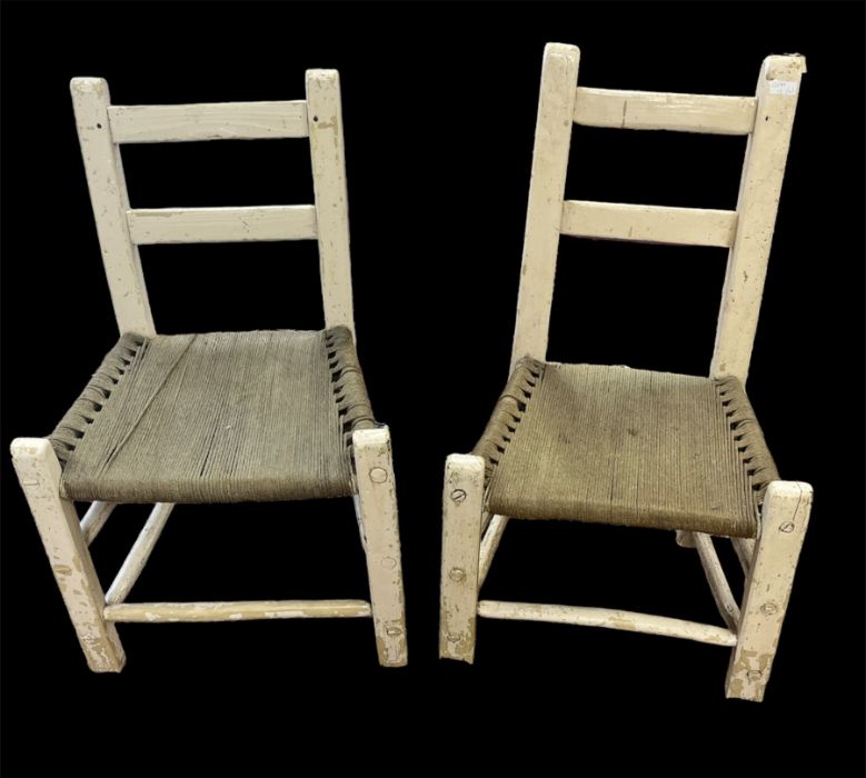 A matched set of four early 19th century Irish ladderback 'Sugan' chairs, County Cork, painted in