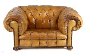 A leather upholstered deep armchair, the button back and scroll arms above the button seat raised on