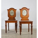 Pair of Victorian mahogany hall chairs, the backs decorated with Coat of Arms, 90cm high (2)