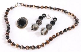 Suite of banded agate jewellery to include a necklace formed of spherical beads pair of earrings and