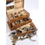 Wooden jewellery box formed as a chest of drawers with contents of various costume jewellery and