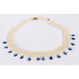 Pearl and Kyanite woven necklace, with three strands of pearls together with pear shape kyanite