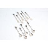 Set of six Dutch white metal cake forks and five matching tea spoons, the handles cast as musicians,