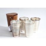 Set of four silver plated stirrup cups, of tapering form with engine turned exteriors, 11cm high,