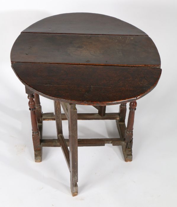 A William & Mary oak gateleg occasional table, circa 1690 Having an oval drop-leaf top formed from - Image 2 of 2