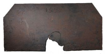 A large William & Mary iron fire back, dated 1689 The rectangular back with canted corners, upper