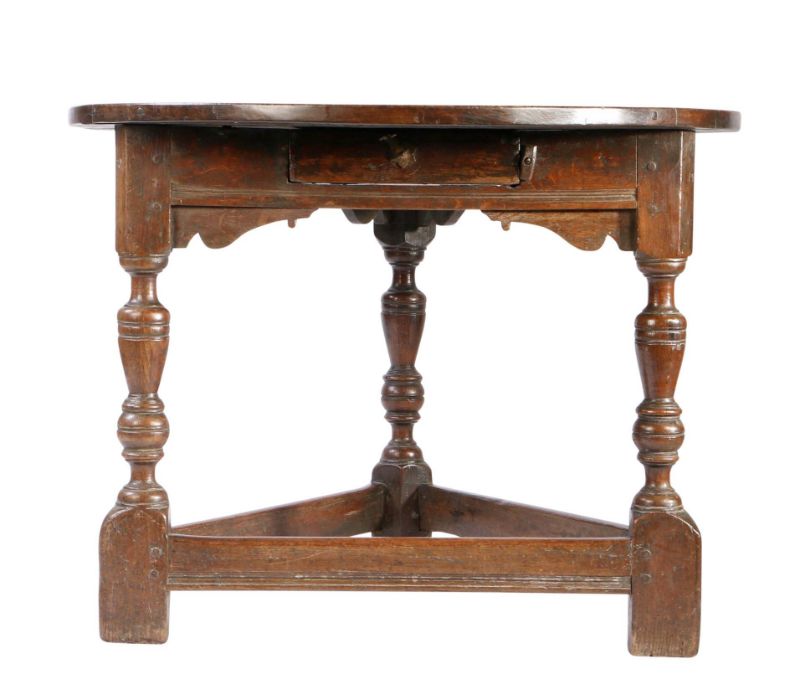 A rare Elizabeth I large joined oak 'cricket-type' centre table, with drawer, circa 1580 Having a