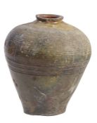 A large terracotta urn, possibly Qing Dynasty, or earlier, Chinese  Of elongated globular form, with