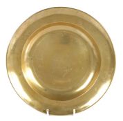A rare George II brass plate, circa 1750 Having a gently curved single-reed rim, and incised line