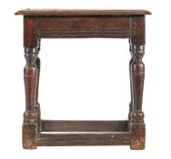 A James I/Charles I oak  joint Stool, circa 1620-30 Having an ovolo-moulded top, lower edge-