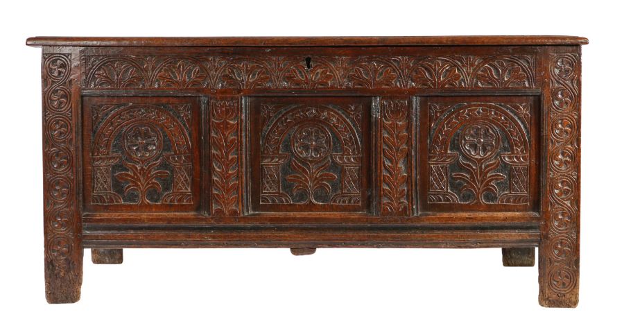 A Charles II oak and black-stained coffer, Devon,  circa 1660 Having a quadruple-panelled lid, the