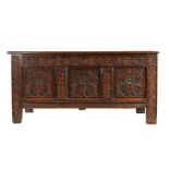 A Charles II oak and black-stained coffer, Devon,  circa 1660 Having a quadruple-panelled lid, the