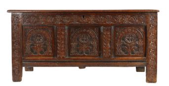 A Charles II oak and black-stained coffer, Devon,  circa 1660 Having a quadruple-panelled lid, the
