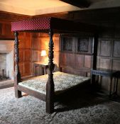 A rare Elizabeth I oak tester bed, circa 1580 Having a twelve-panelled tester, each panel carved