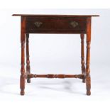 A George I joined oak and elm side table, circa 1715 The triple-boarded top with ovolo-moulded edge,