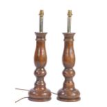 A pair of elm turned table lamps Each of balustroid design, with deep circular base, 66cm high, (