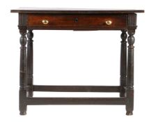 A Charles II oak side table, circa 1670 Having a twin-plank top with square-edge, single frieze