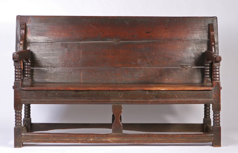 A Charles II oak table settle, circa 1680 Having a boarded and end-cleated back/top, on four ball- - Image 3 of 6
