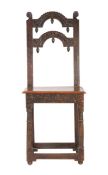 An unusual Charles II oak backstool, circa 1665 The back of two arch-shaped narrow splats, carved