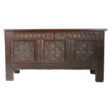 A Charles II joined oak coffer, Cumbrian, dated 1660 Having a quadruple-panelled lid, the front of