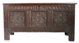 A Charles II joined oak coffer, Cumbrian, dated 1660 Having a quadruple-panelled lid, the front of