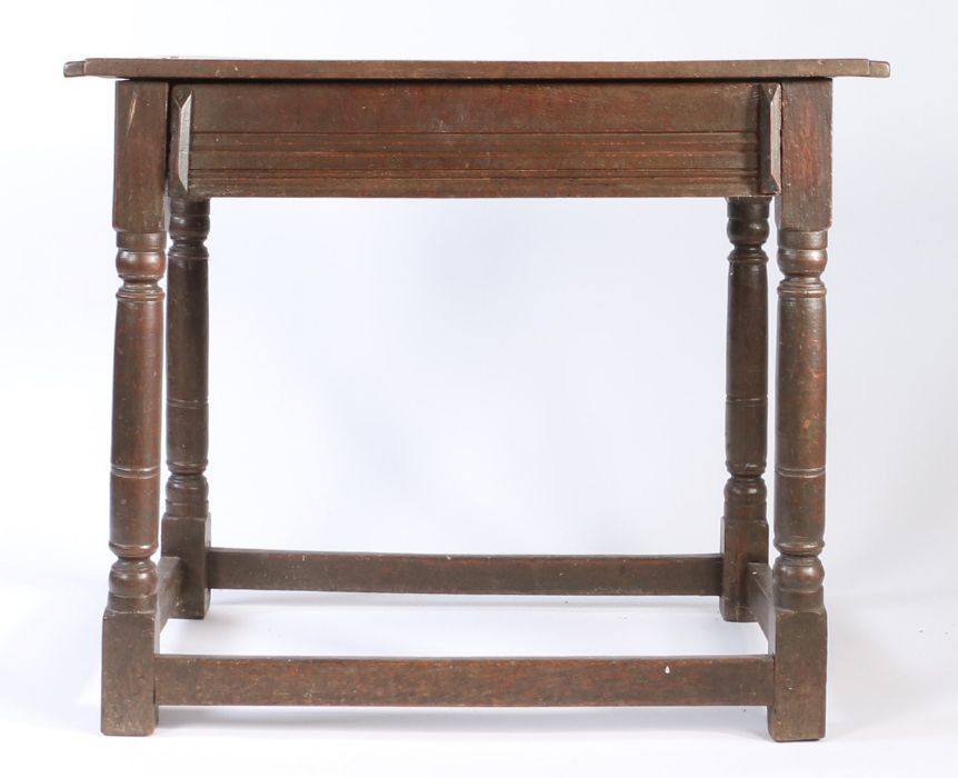 A Charles II oak side table, circa 1680 Having an end-cleated twin-boarded top, a run-moulded drawer - Image 3 of 4