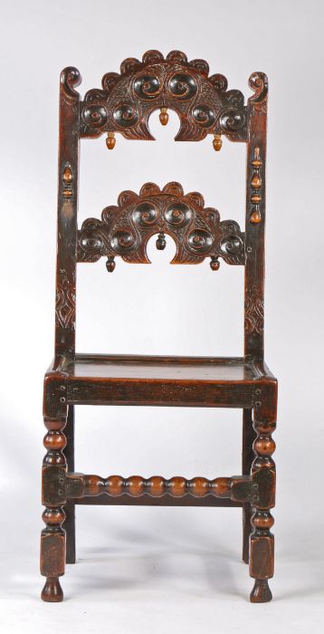 A Charles II oak backstool, Yorkshire, circa 1670 Having a pair of arched splats, each carved with - Image 3 of 4