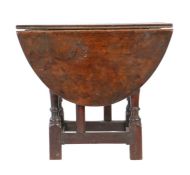 An oak table stool: a rare Elizabeth I oak joint stool, circa 1580, with a 17th century oval drop-