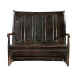 A George III stained pine bowed high-back settle, West Country, circa 1800 The back of five