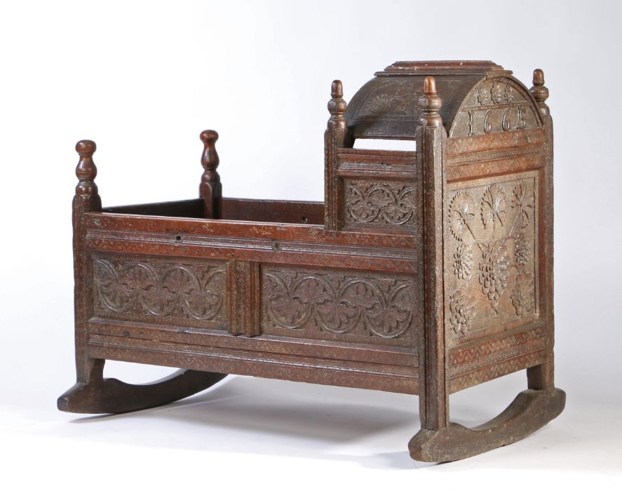 A good Charles II oak cradle, West Country, dated 1665 Having an arched hood, panelled sides, and - Image 4 of 4