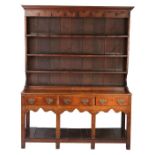 A George III oak high dresser, South Wales, circa 1770 The boarded rack with cavetto-moulded