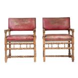 A pair of walnut and 'hide' upholstered 17th century Flemish style open armchairs Each with