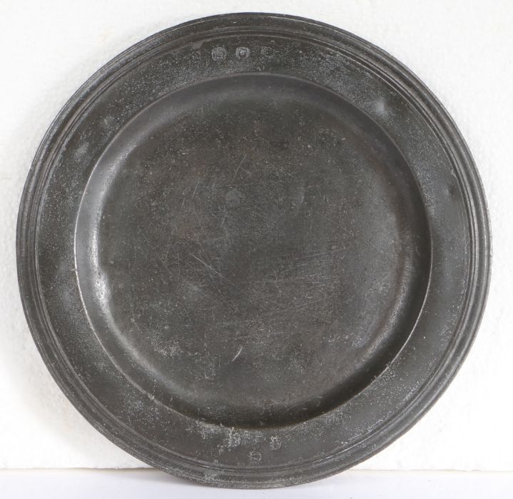 A Queen Anne pewter multi-reeded plate, circa 1705 With hallmarks to front rim and touchmark to rear