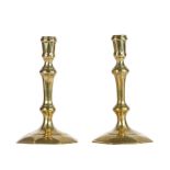 A good pair of Queen Anne/George I brass socket candlesticks, circa 1715 Each with moulded socket,