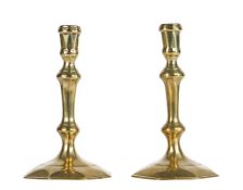 A good pair of Queen Anne/George I brass socket candlesticks, circa 1715 Each with moulded socket,